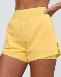 Woman wearing Challenger 3" Lined Performance Short - Lemon | Model:Issy | Size:XS | Thumbnail Index: 0