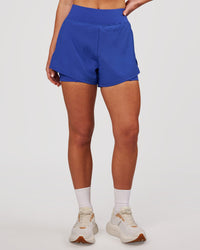Woman wearing Challenger 3" Lined Performance Short - Power Cobalt | Model:Issy | Size:XS | Thumbnail Index: 5