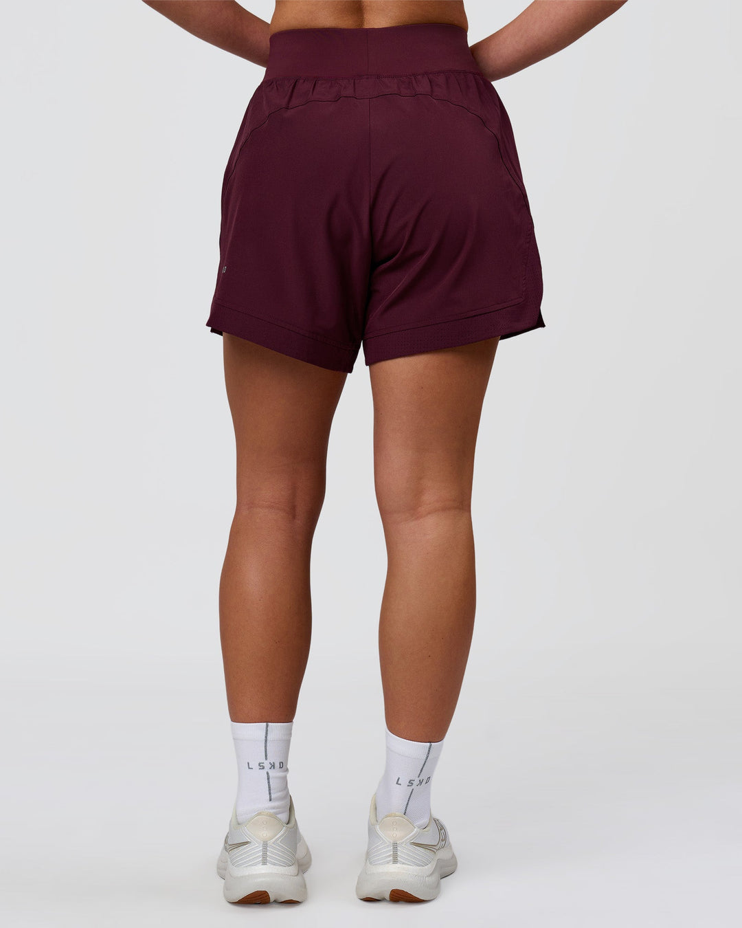 Woman wearing Challenger 5" Lined Performance Short - Cherry Lacquer | Model:Issy | Size:XS - view 4