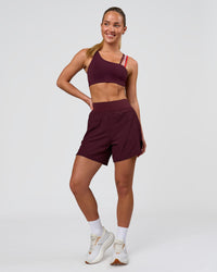 Woman wearing Challenger 5" Lined Performance Short - Cherry Lacquer | Model:Issy | Size:XS | Thumbnail Index: 4