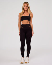 Woman wearing Dare High-Rise Full Length Legging - Black | Model:Issy | Size:XS | Thumbnail Index: 4