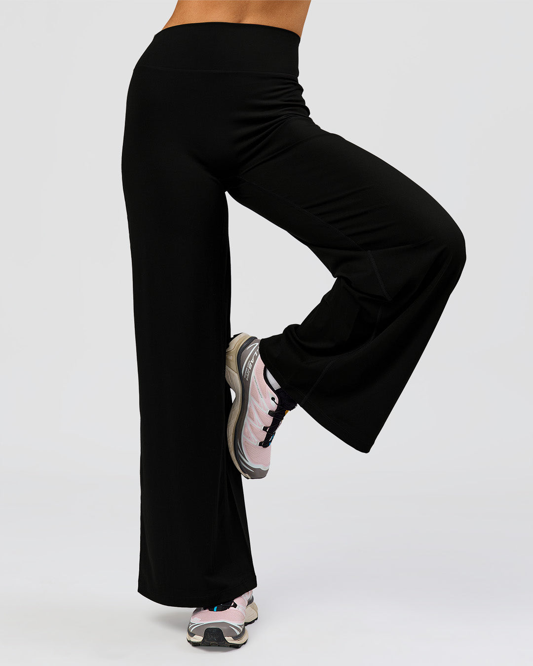 Woman wearing Elixir High-Rise Petite Pant - Black | Model:Issy | Size:XS - view 11
