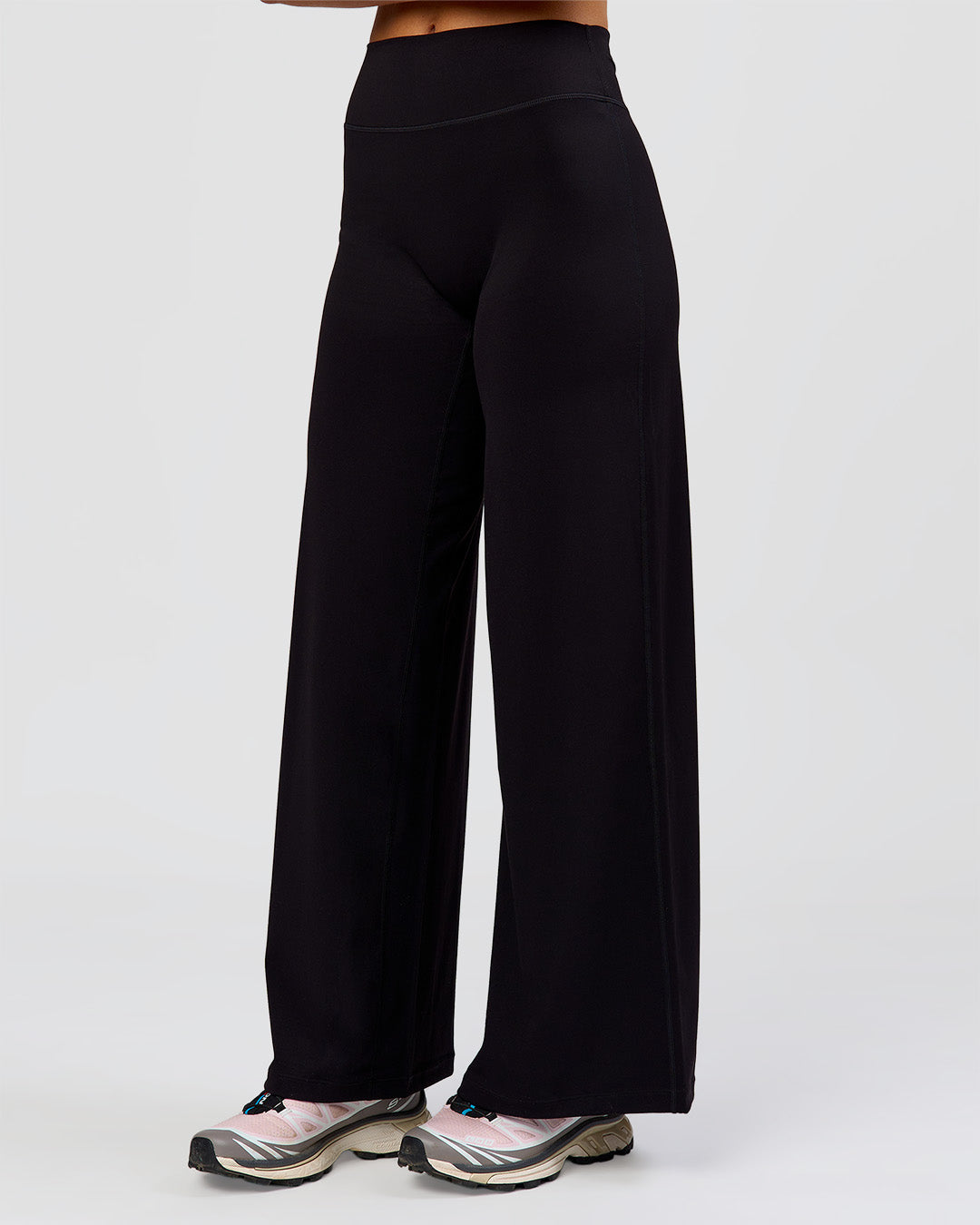 Woman wearing Elixir High-Rise Petite Pant - Black | Model:Issy | Size:XS - view 13
