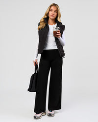 Woman wearing Elixir High-Rise Petite Pant - Black | Model:Issy | Size:XS | Thumbnail Index: 8