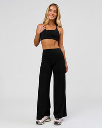 Woman wearing Elixir High-Rise Petite Pant - Black | Model:Issy | Size:XS | Thumbnail Index: 7