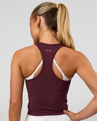 Woman wearing Flow Performance Tank 2.0 - Cherry Lacquer | Model:Issy | Size:XS | Thumbnail Index: 2
