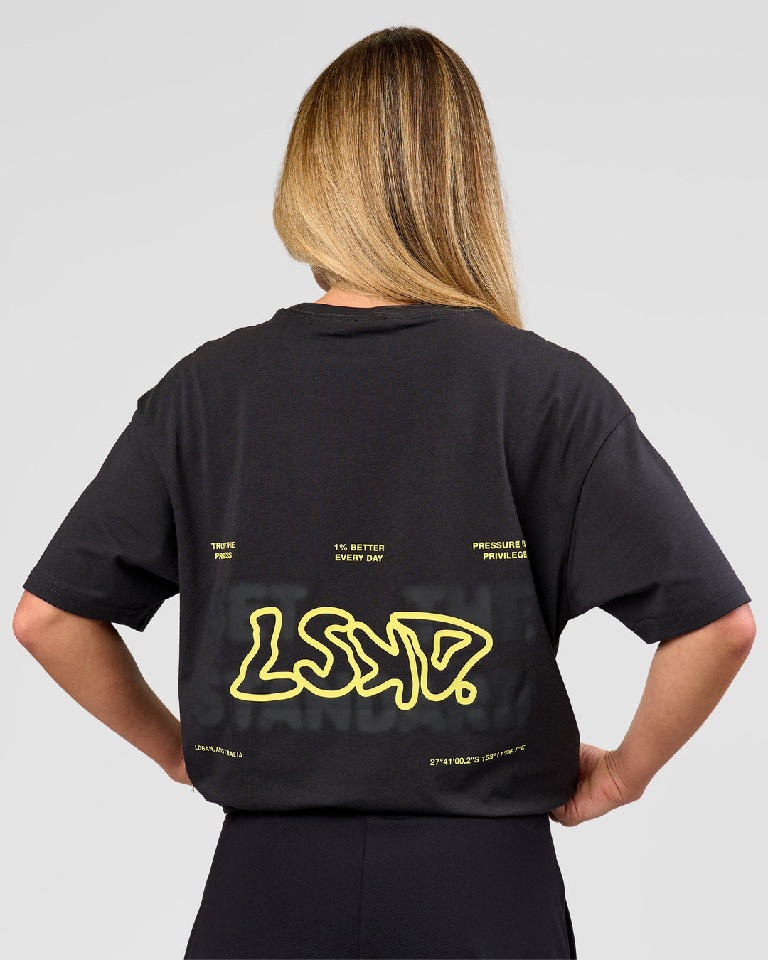 Woman wearing Benchmark FLXCotton Oversized Tee - Onyx-Yellow Fizz | Model:Issy | Size:XS - view 10
