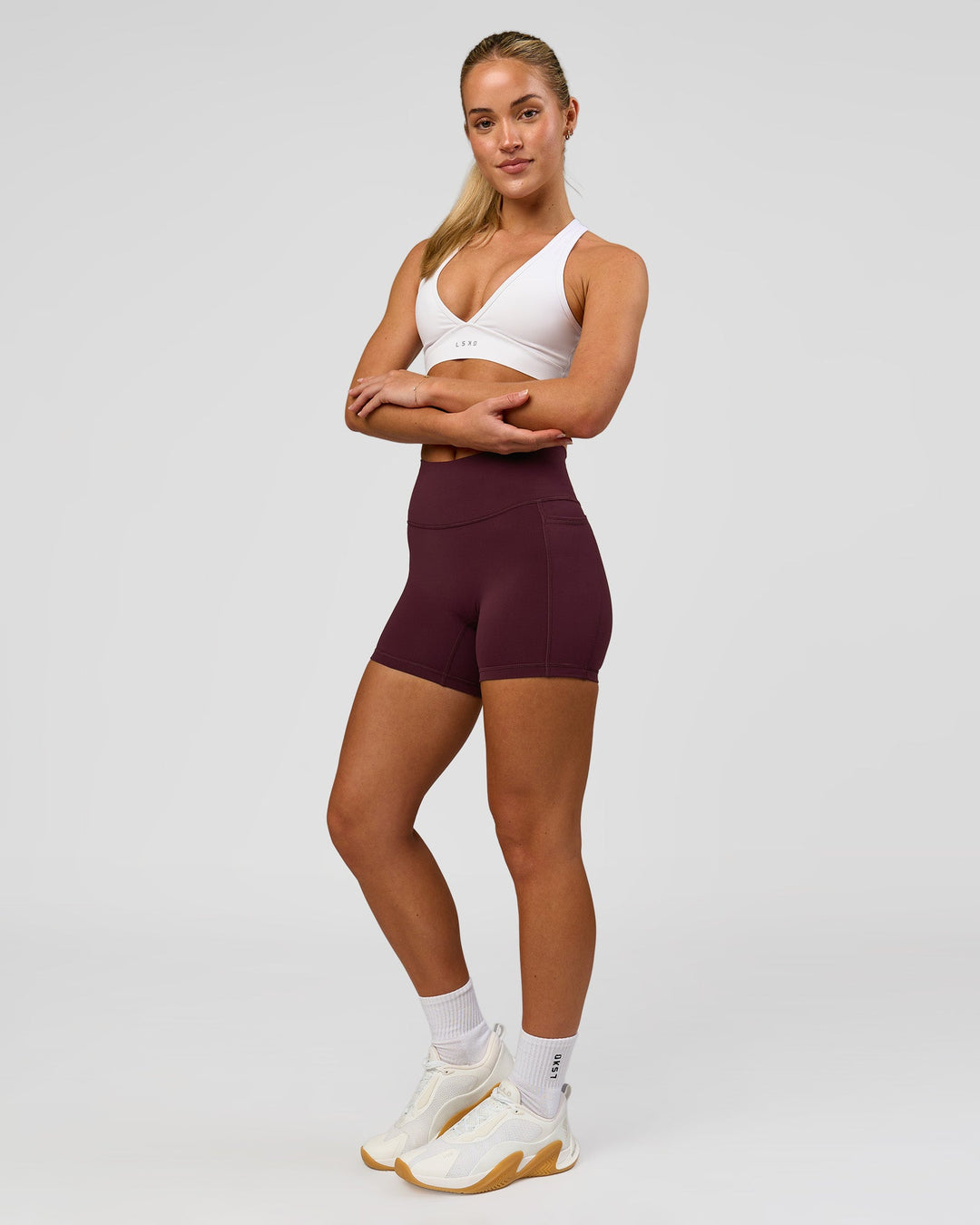 Woman wearing Fusion High-Rise 4" Short Pockets - Cherry Lacquer | Model:Issy | Size:XS - view 2
