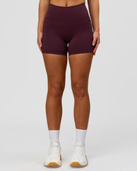 Woman wearing Fusion High-Rise 4" Short Pockets - Cherry Lacquer | Model:Issy | Size:XS | Thumbnail Index: 2