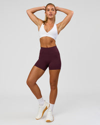 Woman wearing Fusion High-Rise 4" Short Pockets - Cherry Lacquer | Model:Issy | Size:XS | Thumbnail Index: 5