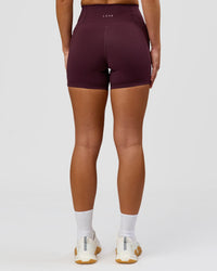 Woman wearing Fusion High-Rise 4" Short Pockets - Cherry Lacquer | Model:Issy | Size:XS | Thumbnail Index: 7