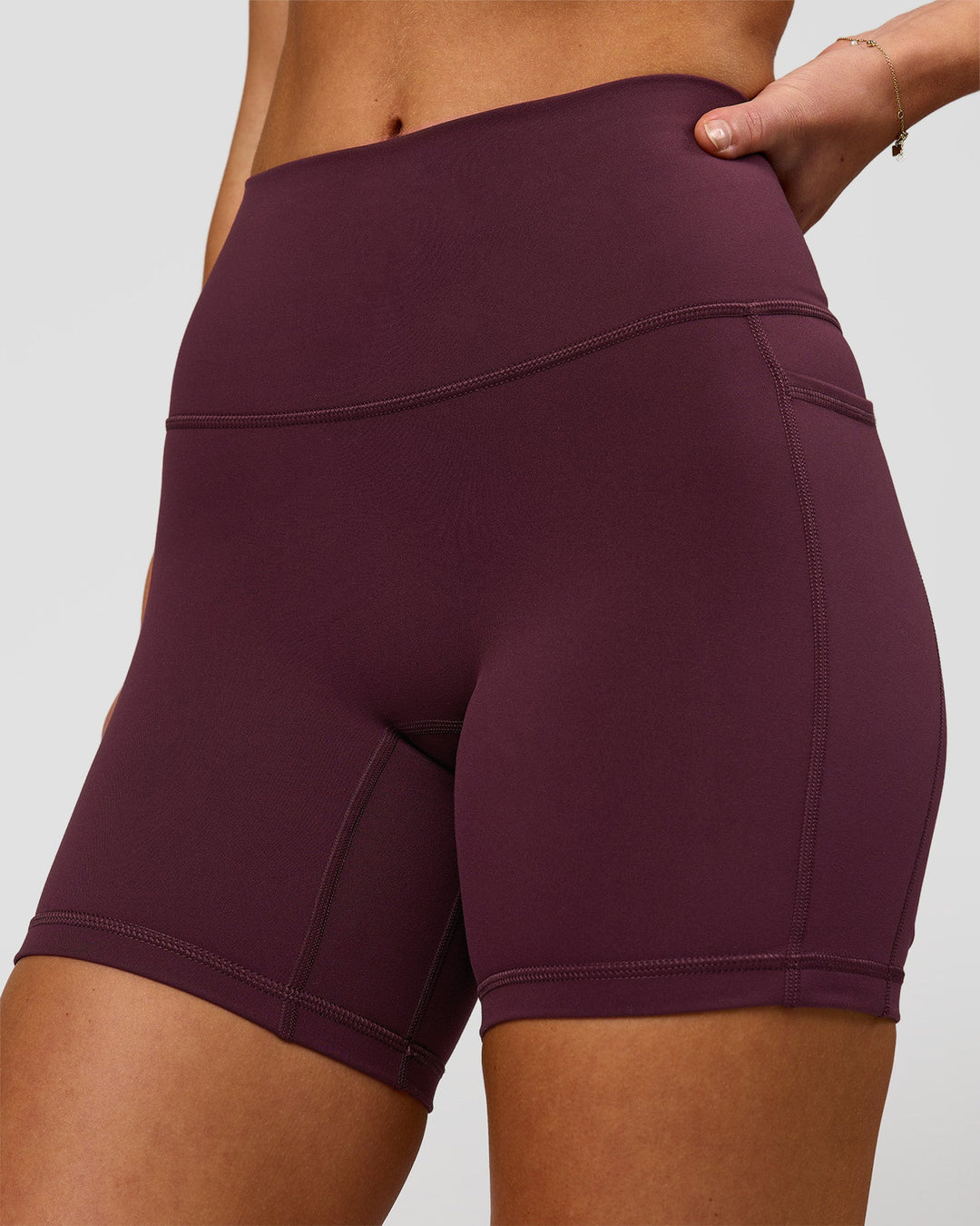 Woman wearing Fusion High-Rise 6" Short Pockets - Cherry Lacquer | Model:Issy | Size:XS - view 2