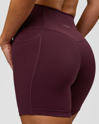 Woman wearing Fusion High-Rise 6" Short Pockets - Cherry Lacquer | Model:Issy | Size:XS | Thumbnail Index: 2