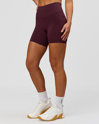Woman wearing Fusion High-Rise 6" Short Pockets - Cherry Lacquer | Model:Issy | Size:XS | Thumbnail Index: 3