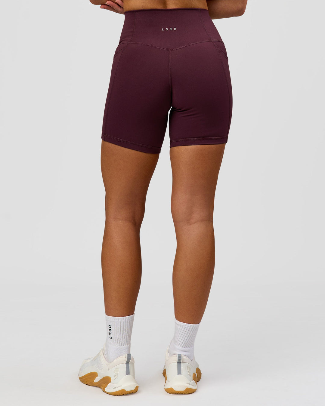 Woman wearing Fusion High-Rise 6" Short Pockets - Cherry Lacquer | Model:Issy | Size:XS - view 5