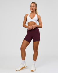 Woman wearing Fusion High-Rise 6" Short Pockets - Cherry Lacquer | Model:Issy | Size:XS | Thumbnail Index: 6