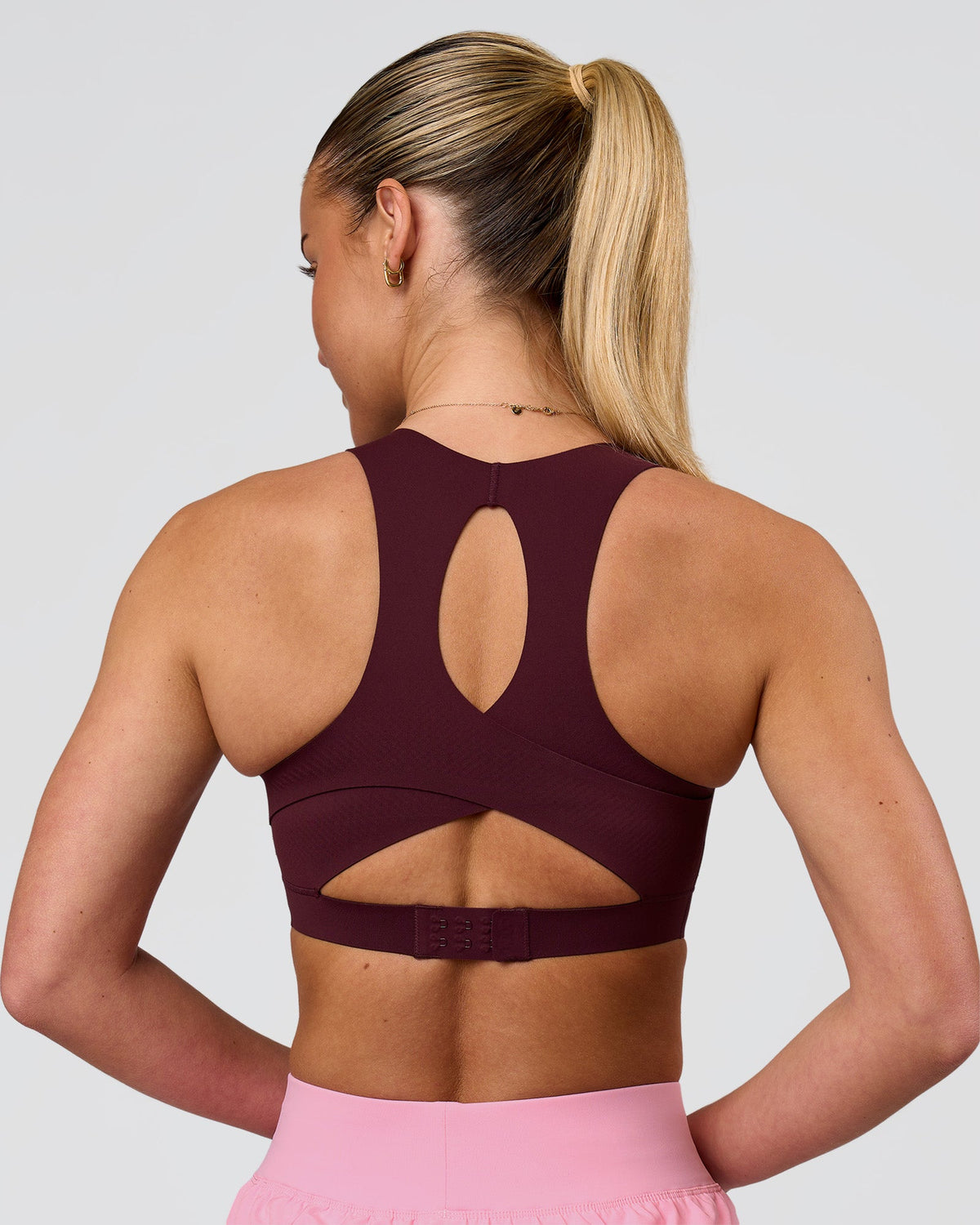 Woman wearing Fusion Sports Bra 2.0 - Cherry Lacquer | Model:Issy | Size:XS