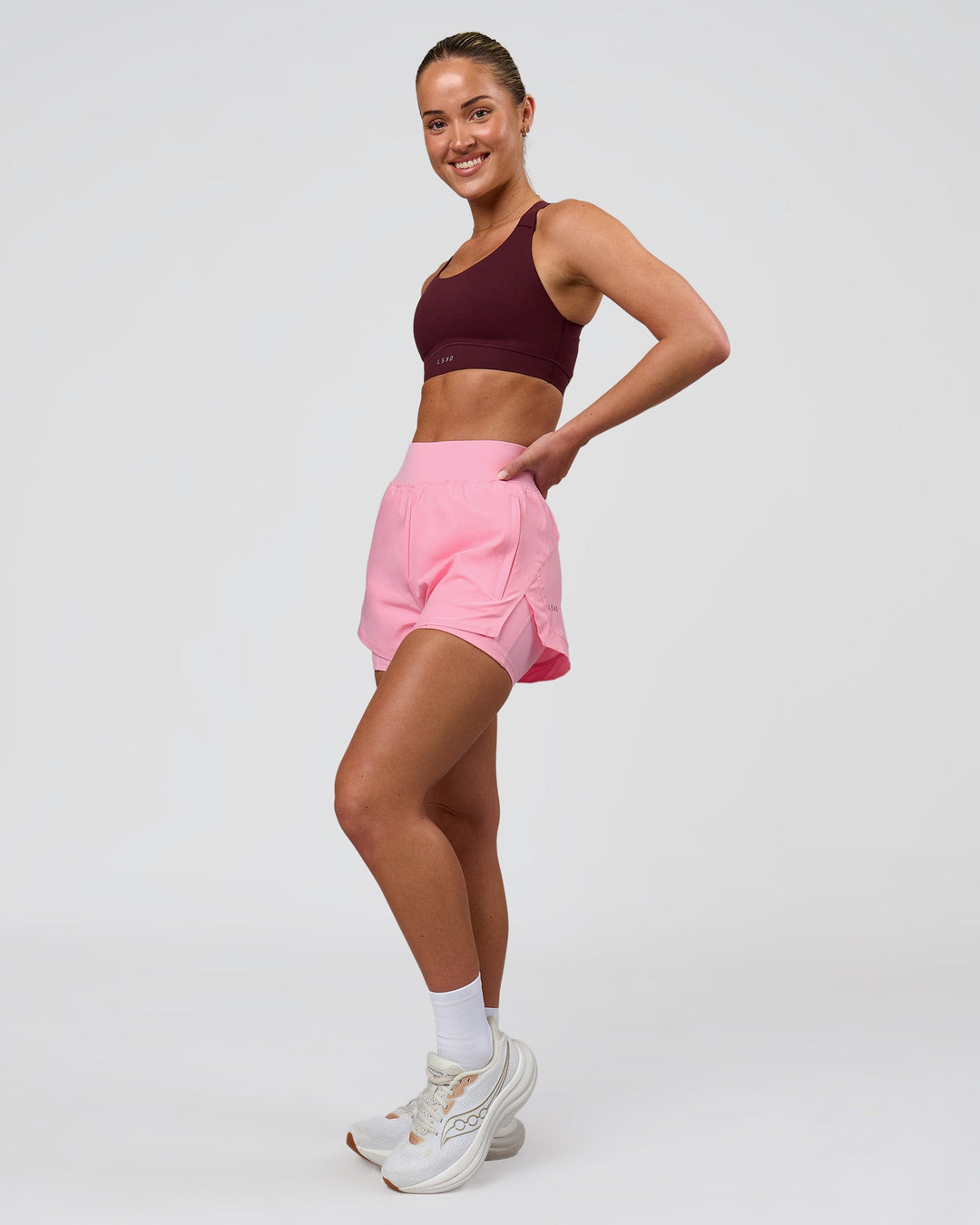 Woman wearing Fusion Sports Bra 2.0 - Cherry Lacquer | Model:Issy | Size:XS - view 4