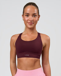 Woman wearing Fusion Sports Bra 2.0 - Cherry Lacquer | Model:Issy | Size:XS | Thumbnail Index: 2