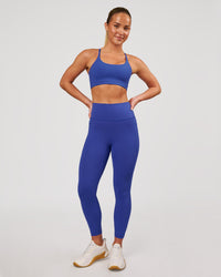 Woman wearing Fusion V-Contour Ultra High-Rise 7/8 Legging Pockets - Power Cobalt | Model:Issy | Size:XS | Thumbnail Index: 6