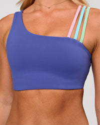Woman wearing Galvanise Sports Bra 2.0 - Power Cobalt-Prism | Model:Issy | Size:XS | Thumbnail Index: 0