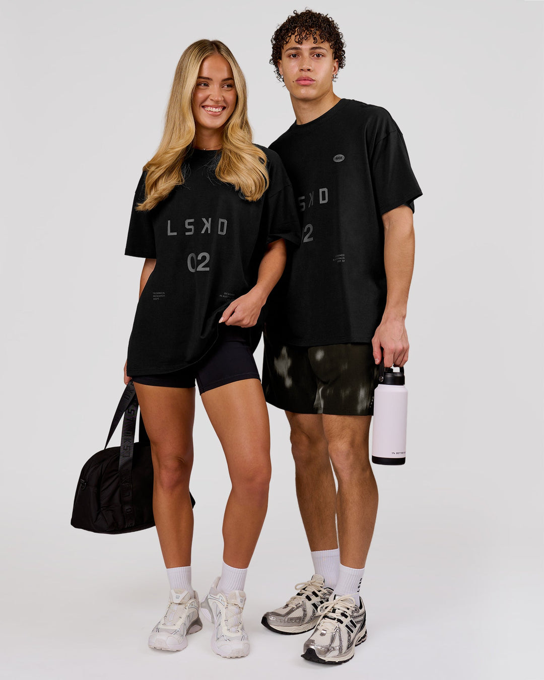 Woman wearing Game Plan Heavyweight FLXCotton Oversized Tee - Black | Model:Issy | Size:XS - view 7