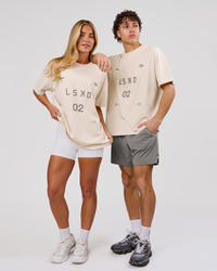 Woman wearing Game Plan Heavyweight FLXCotton Oversized Tee - Vanilla Bean | Model:Issy | Size:XS | Thumbnail Index: 12