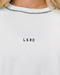 Woman wearing Go-To Contrast Oversized Heavyweight FLXCotton Tee - White-Black | Model:Issy | Size:XS | Thumbnail Index: 2