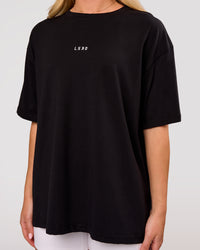 Woman wearing Go-To FLXCotton Oversized Tee - Black-White | Model:Issy | Size:XS | Thumbnail Index: 1