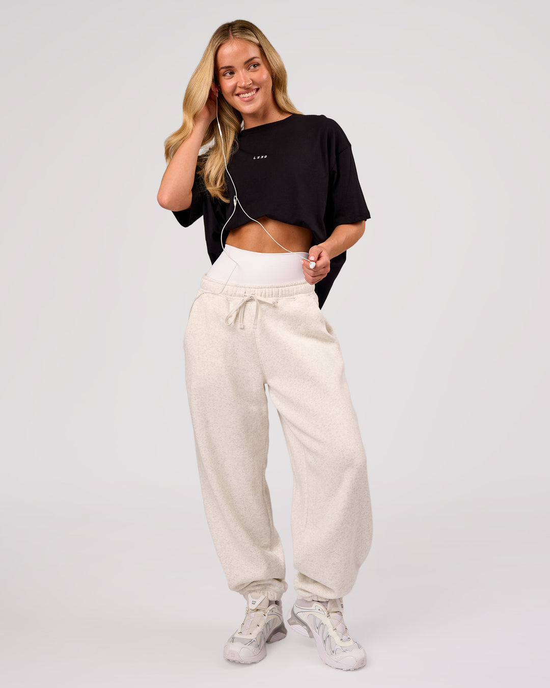 Woman wearing Go-To FLXCotton Oversized Tee - Black-White | Model:Issy | Size:XS - view 5