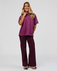 Woman wearing Go-To FLXCotton Oversized Tee - Boysenberry-White | Model:Issy | Size:XS | Thumbnail Index: 2