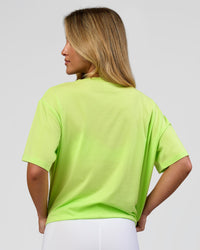 Woman wearing Go-To FLXCotton Oversized Tee - Lime Glo-White | Model:Issy | Size:XS | Thumbnail Index: 2