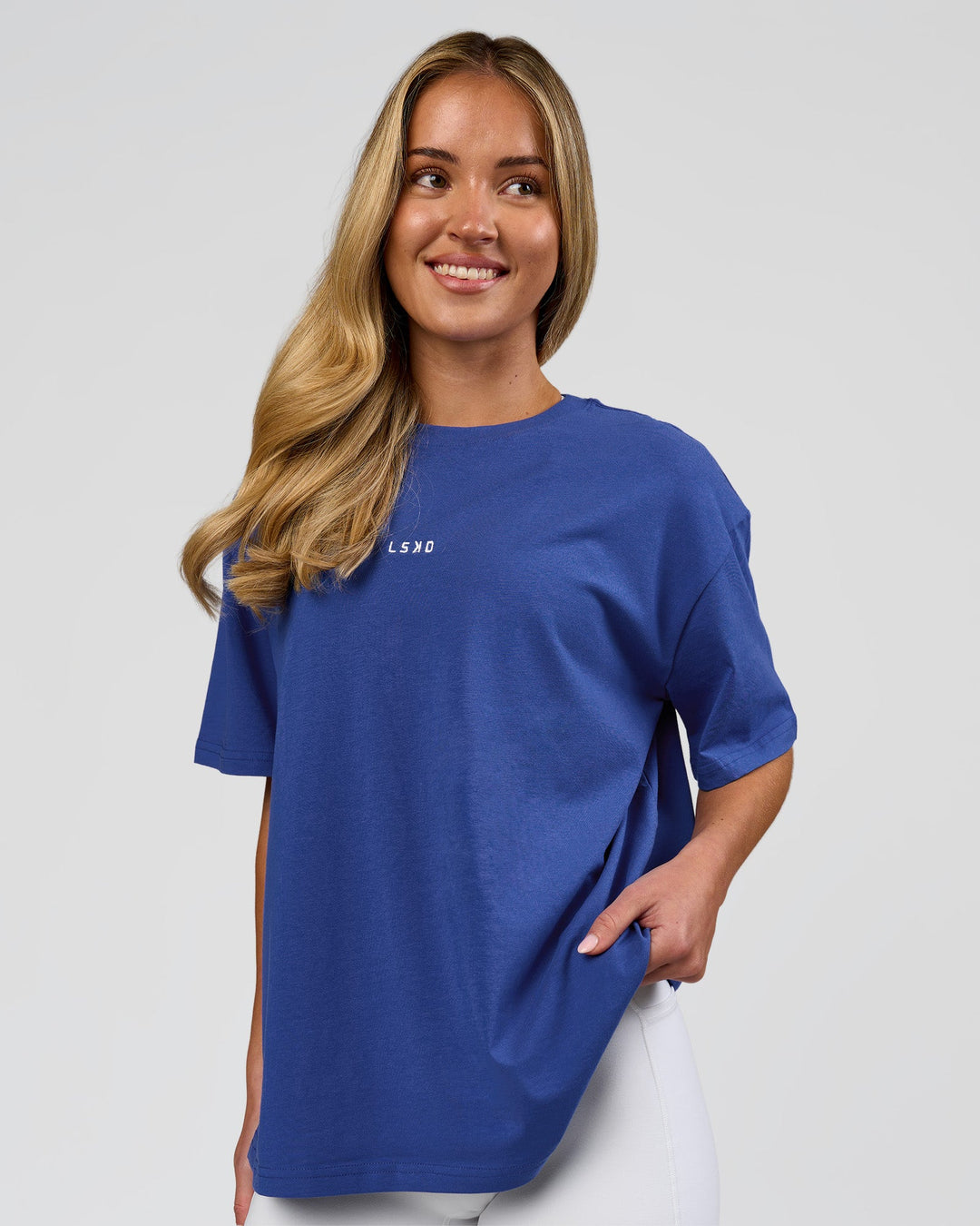 Woman wearing Go-To FLXCotton Oversized Tee - Power Cobalt-White | Model:Issy | Size:XS - view 1