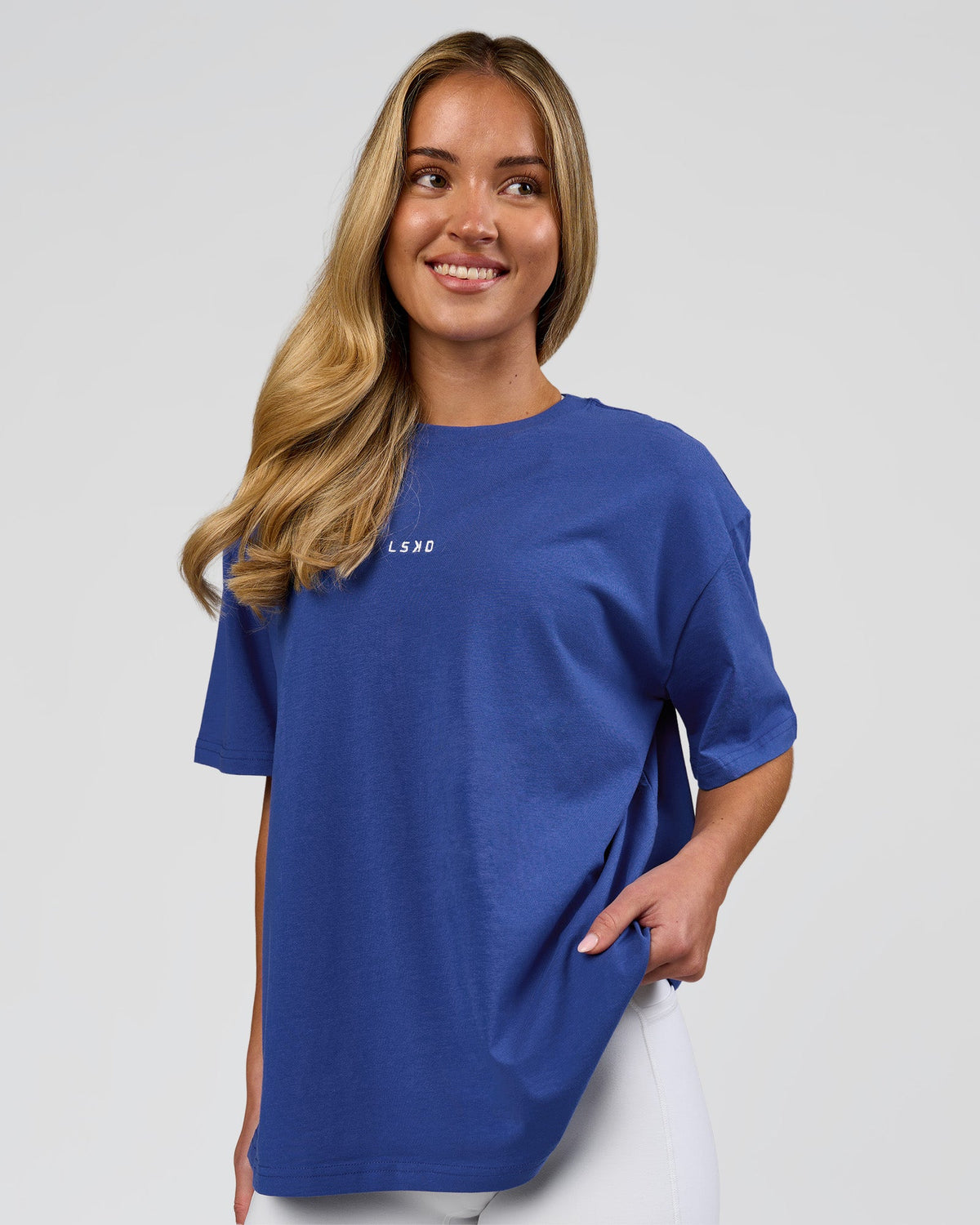 Woman wearing Go-To FLXCotton Oversized Tee - Power Cobalt-White | Model:Issy | Size:XS