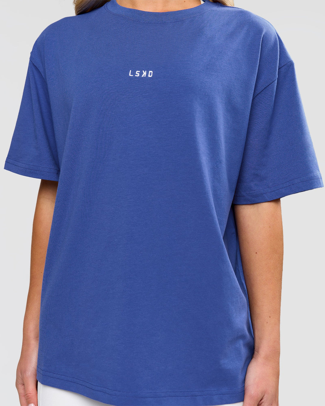 Woman wearing Go-To FLXCotton Oversized Tee - Power Cobalt-White | Model:Issy | Size:XS - view 2