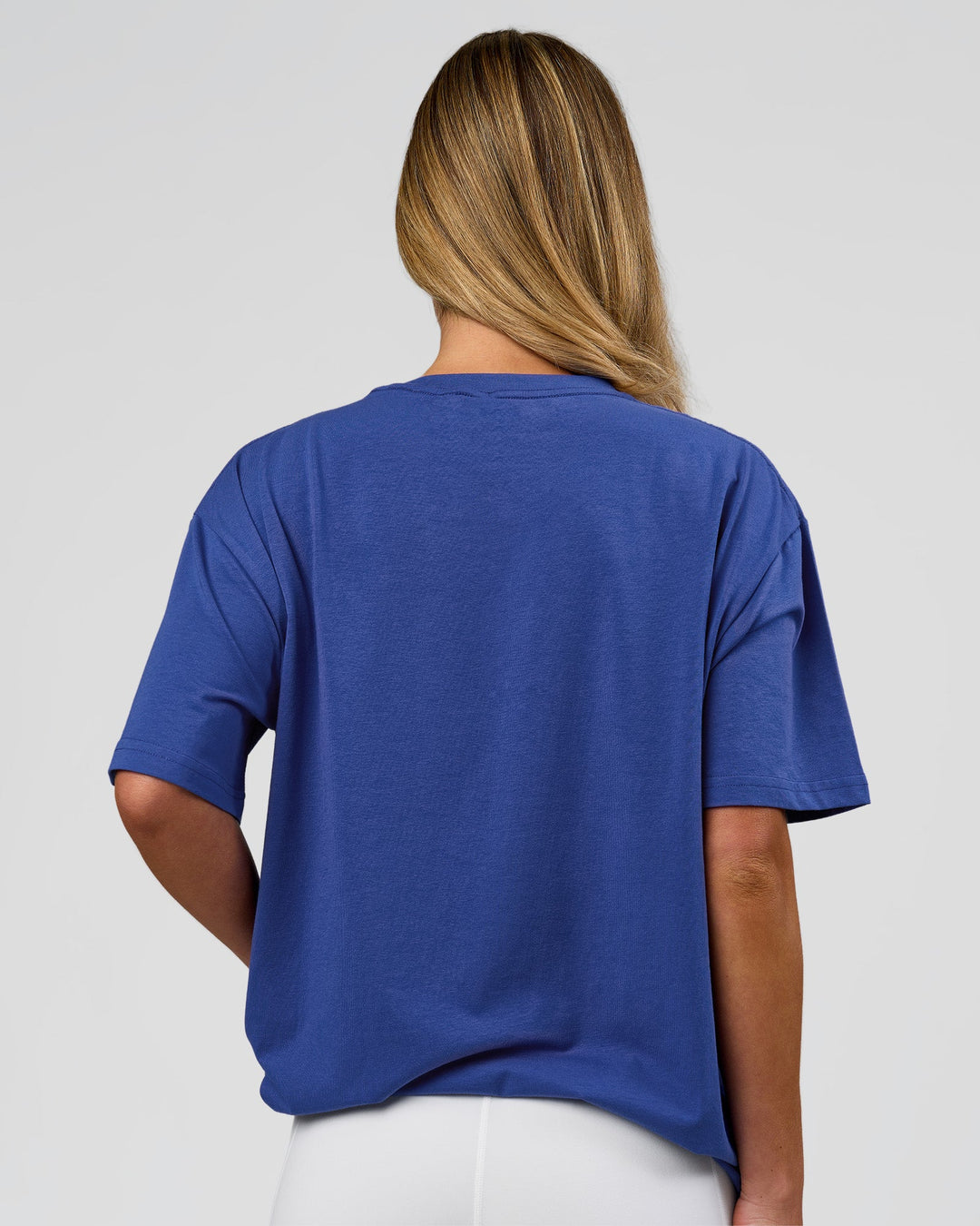 Woman wearing Go-To FLXCotton Oversized Tee - Power Cobalt-White | Model:Issy | Size:XS - view 8
