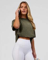 Woman wearing Go-To FLXCotton Oversized Tee - Pure Olive Washed | Model:Issy | Size:XS | Thumbnail Index: 2