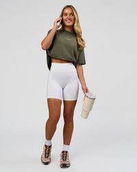 Woman wearing Go-To FLXCotton Oversized Tee - Pure Olive Washed | Model:Issy | Size:XS | Thumbnail Index: 4