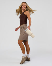 Woman wearing Go-To FLXCotton Rib High Neck Tank - Hot Chocolate | Model:Issy | Size:XS | Thumbnail Index: 4