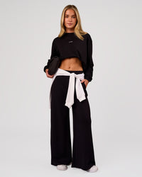 Woman wearing Go-To Long Sleeve FLXCotton Oversized Tee - Black-White | Model:Issy | Size:XS | Thumbnail Index: 1