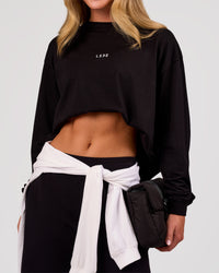 Woman wearing Go-To Long Sleeve FLXCotton Oversized Tee - Black-White | Model:Issy | Size:XS | Thumbnail Index: 2