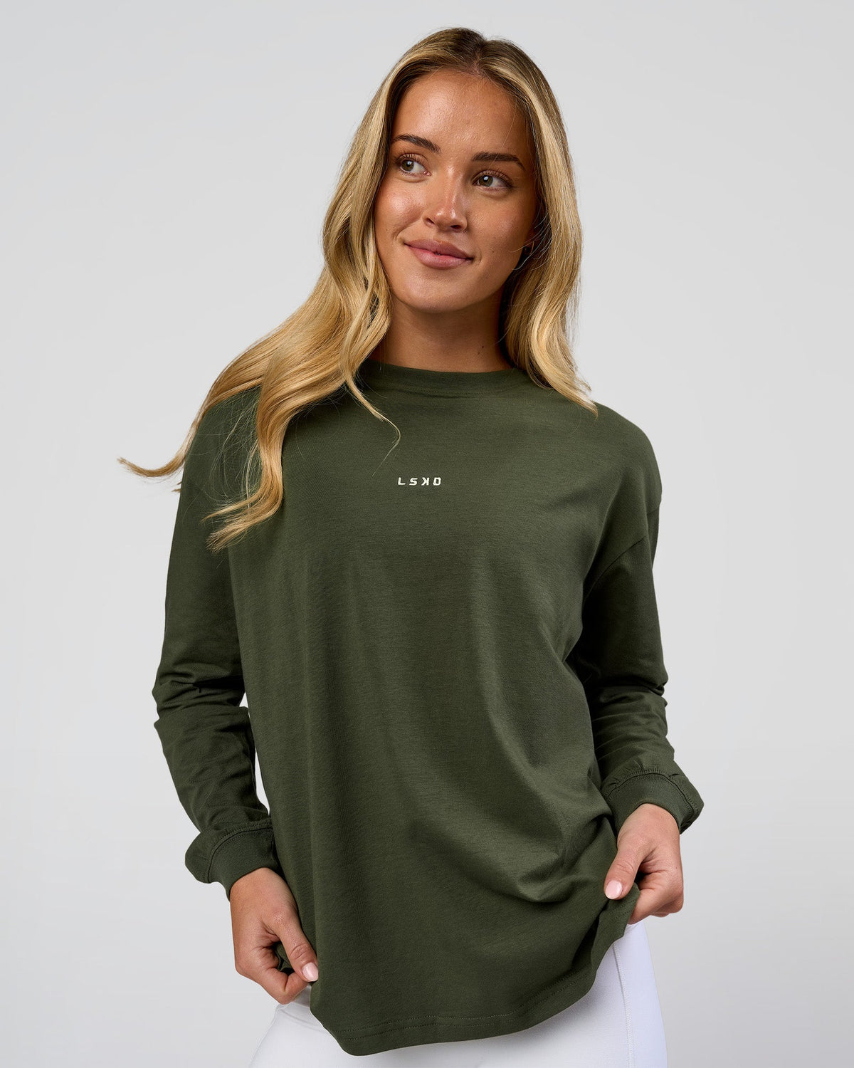 Woman wearing Go-To Long Sleeve FLXCotton Oversized Tee - Pure Olive-White | Model:Issy | Size:XS