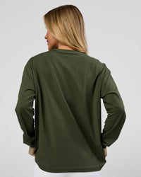 Woman wearing Go-To Long Sleeve FLXCotton Oversized Tee - Pure Olive-White | Model:Issy | Size:XS | Thumbnail Index: 1
