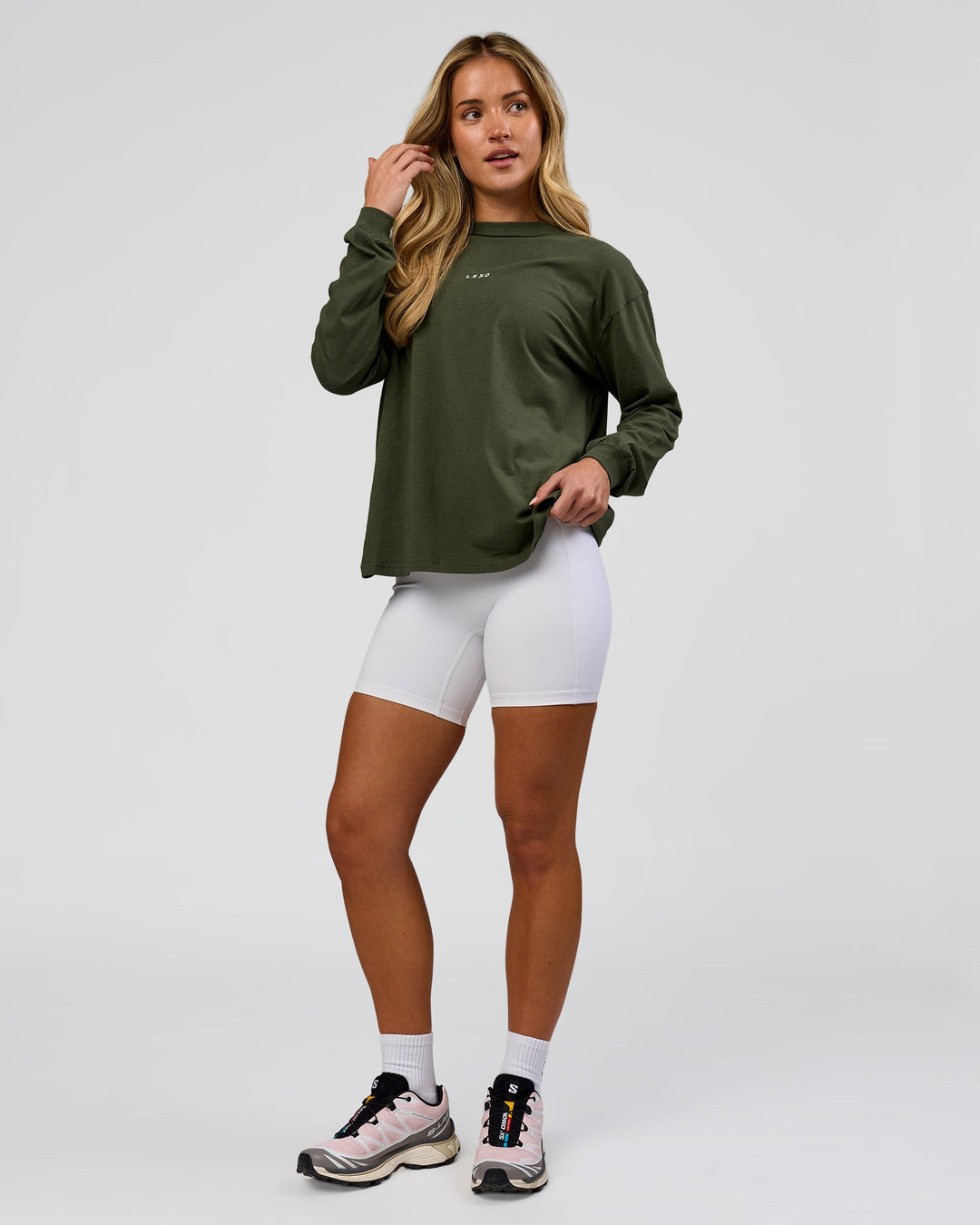 Woman wearing Go-To Long Sleeve FLXCotton Oversized Tee - Pure Olive-White | Model:Issy | Size:XS - view 4