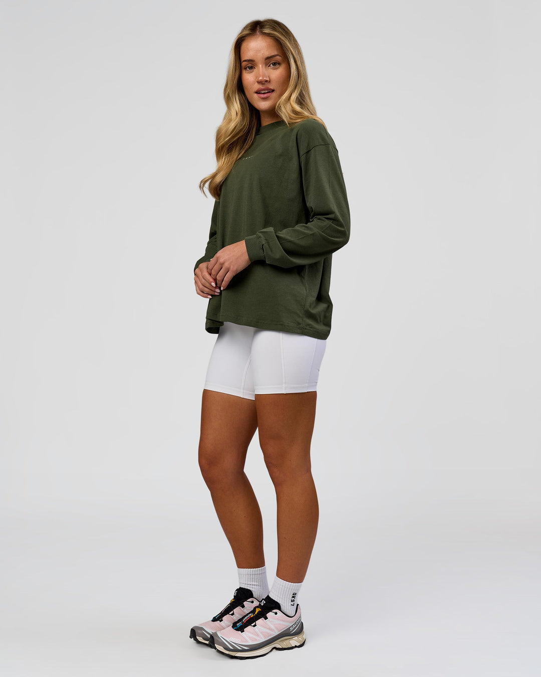 Woman wearing Go-To Long Sleeve FLXCotton Oversized Tee - Pure Olive-White | Model:Issy | Size:XS - view 6