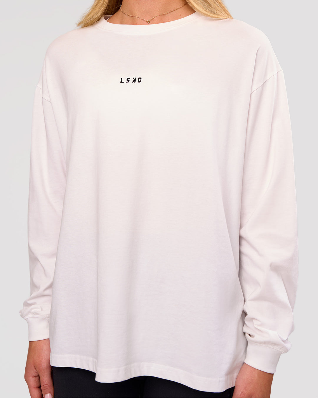 Woman wearing Go-To Long Sleeve FLXCotton Oversized Tee - White-Black | Model:Issy | Size:XS - view 3