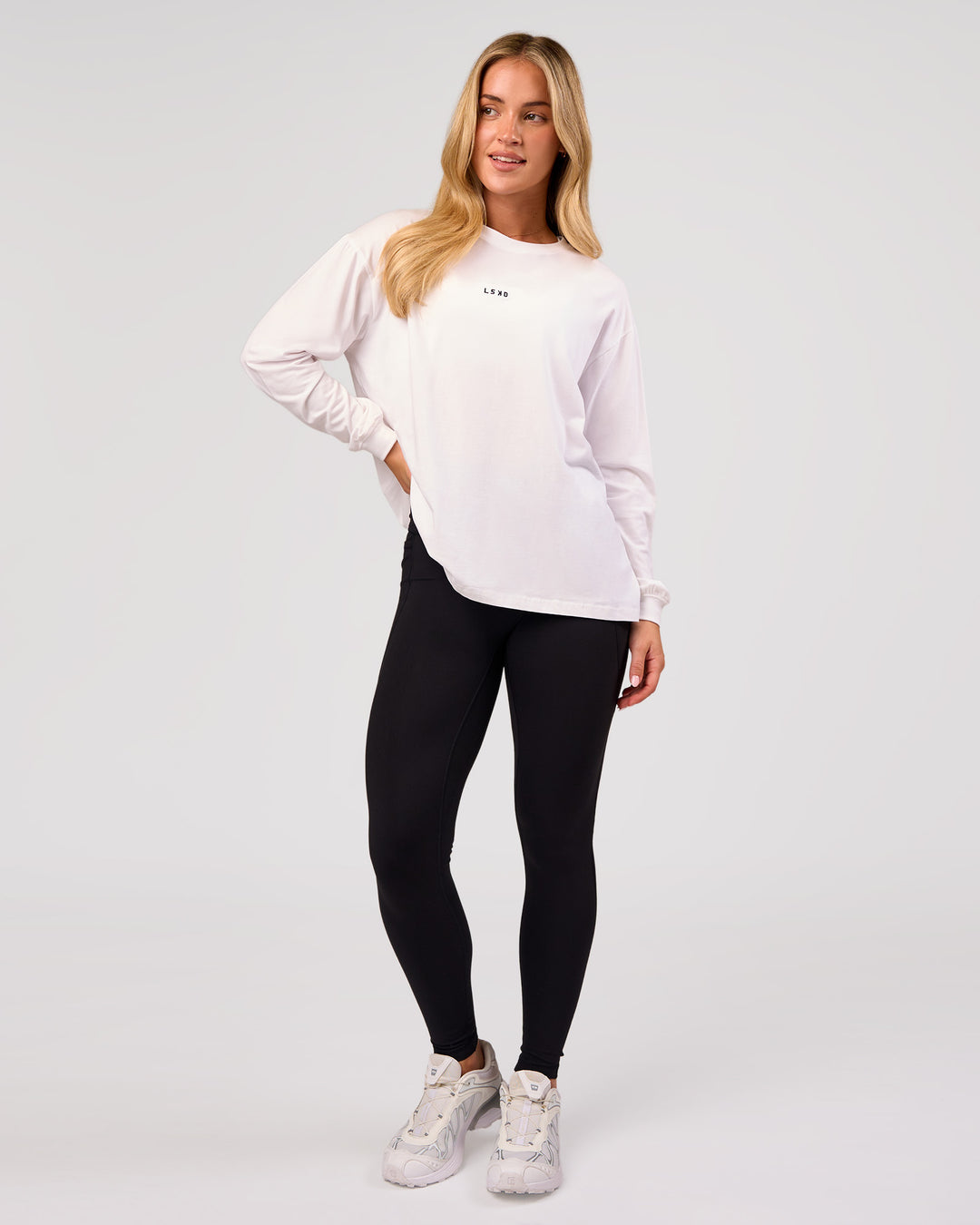 Woman wearing Go-To Long Sleeve FLXCotton Oversized Tee - White-Black | Model:Issy | Size:XS - view 6