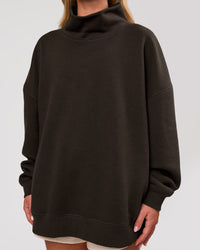 Woman wearing Go-To Oversized Mock Neck Sweater - Ground Coffee | Model:Issy | Size:XS | Thumbnail Index: 1