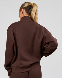 Woman wearing Go-To Oversized Quarter Zip Sweater - Hot Chocolate | Model:Issy | Size:XS