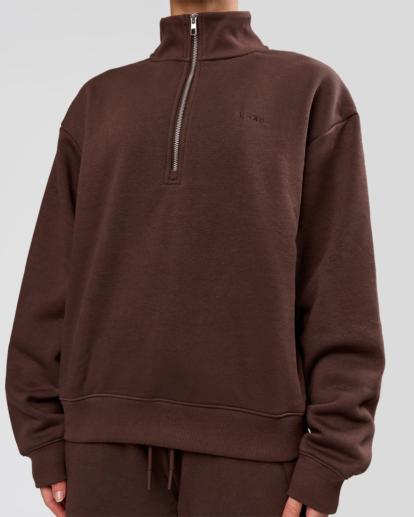 Woman wearing Go-To Oversized Quarter Zip Sweater - Hot Chocolate | Model:Issy | Size:XS